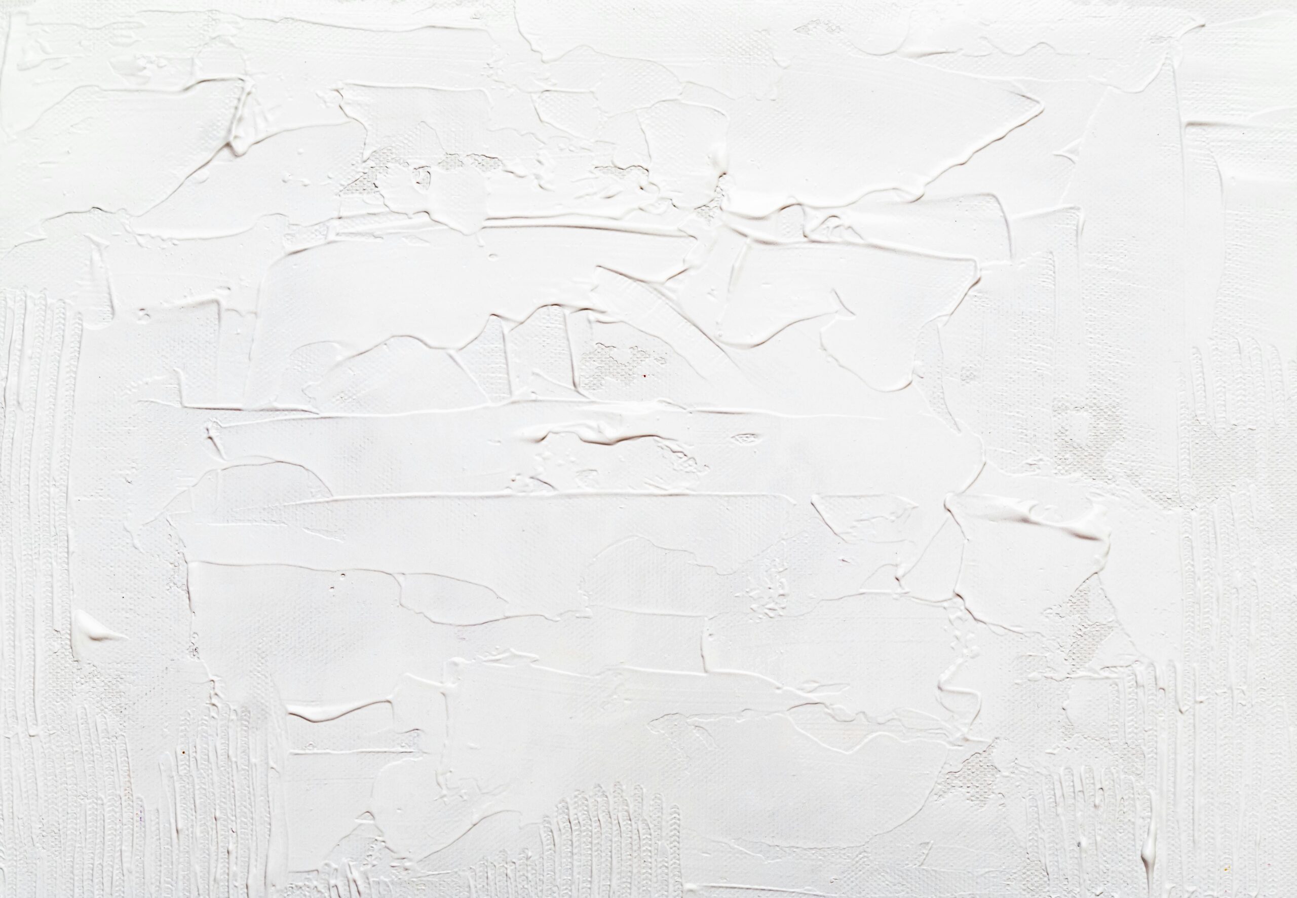 Close-up of a textured and painted white abstract surface, ideal for backgrounds.
